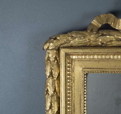 Mirrors, Trumeau  - French Louis XVI Giltwood Mirror with Carved Pediment