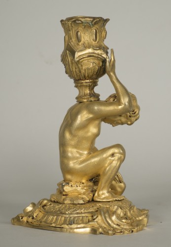 Lighting  - Gilt bronze candlestick depicting a man sat on a rock