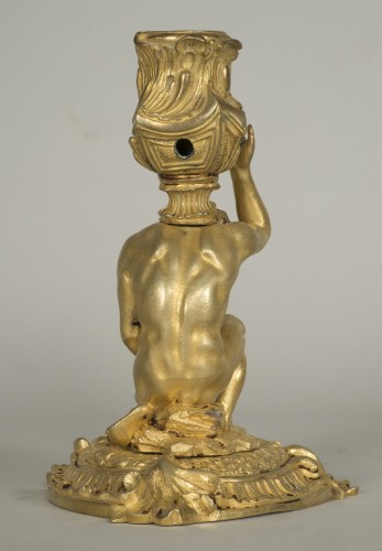 Gilt bronze candlestick depicting a man sat on a rock - 