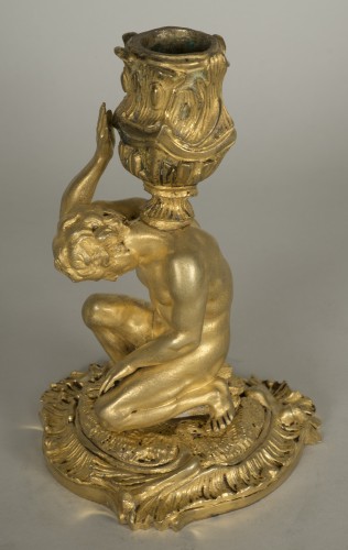  - Gilt bronze candlestick depicting a man sat on a rock