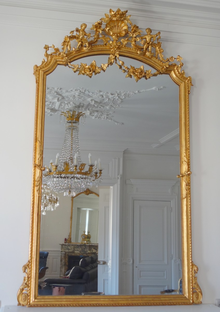 Miroir de cheminée en bois doré, glace au mercure à parecloses vers 1850-60