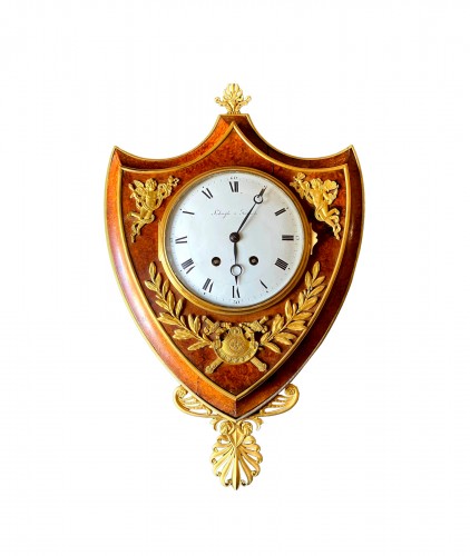 Empire cartel clock in escutcheon