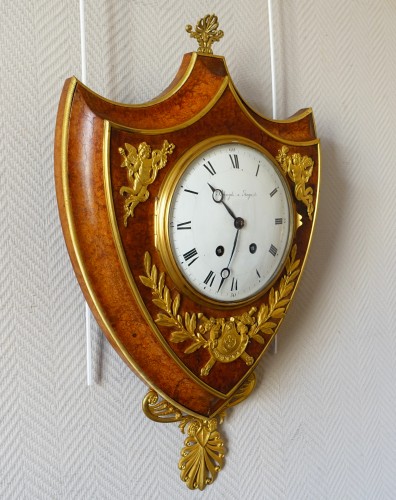 Empire cartel clock in escutcheon - 