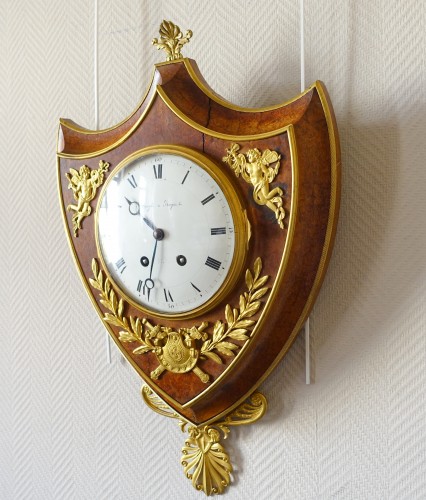 19th century - Empire cartel clock in escutcheon