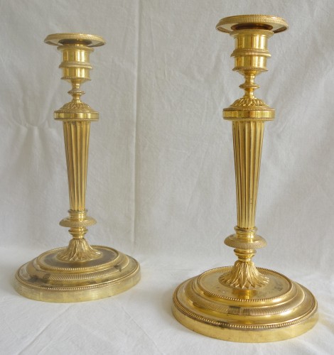 Directoire - Paire de flambeaux en bronze doré fin 18e début 19e siècle