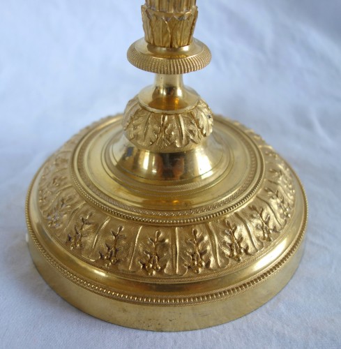 Paire de bougeoirs flambeaux Louis XVI en bronze doré - Directoire
