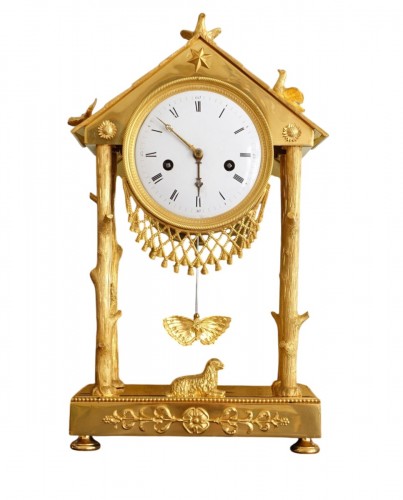 Pendule à la Chaumière d'époque Empire en bronze doré