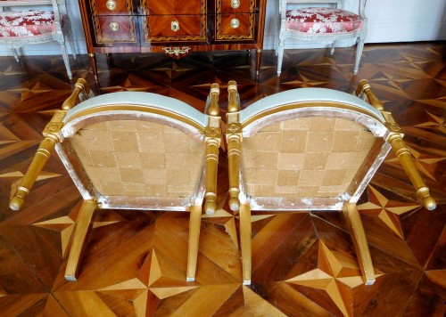 Antiquités - Pair of gilt wood armchairs - France circa 1796-1799