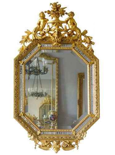 Miroir Napoléon III en bois doré et à parecloses