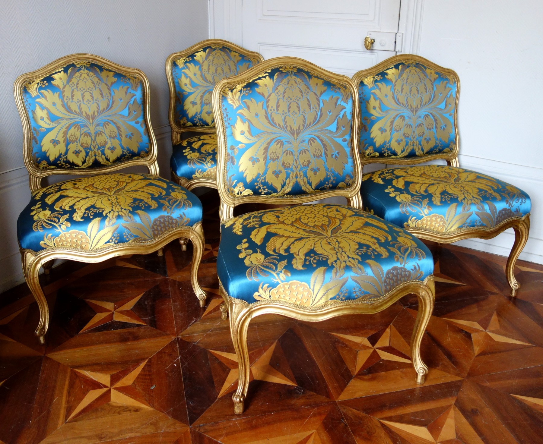 A Louis XV style gilt wood sofa and armchair