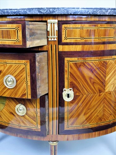 18th century - A half-moon chest of drawers by Vassou
