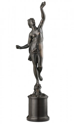 A bronze of a standing female nude