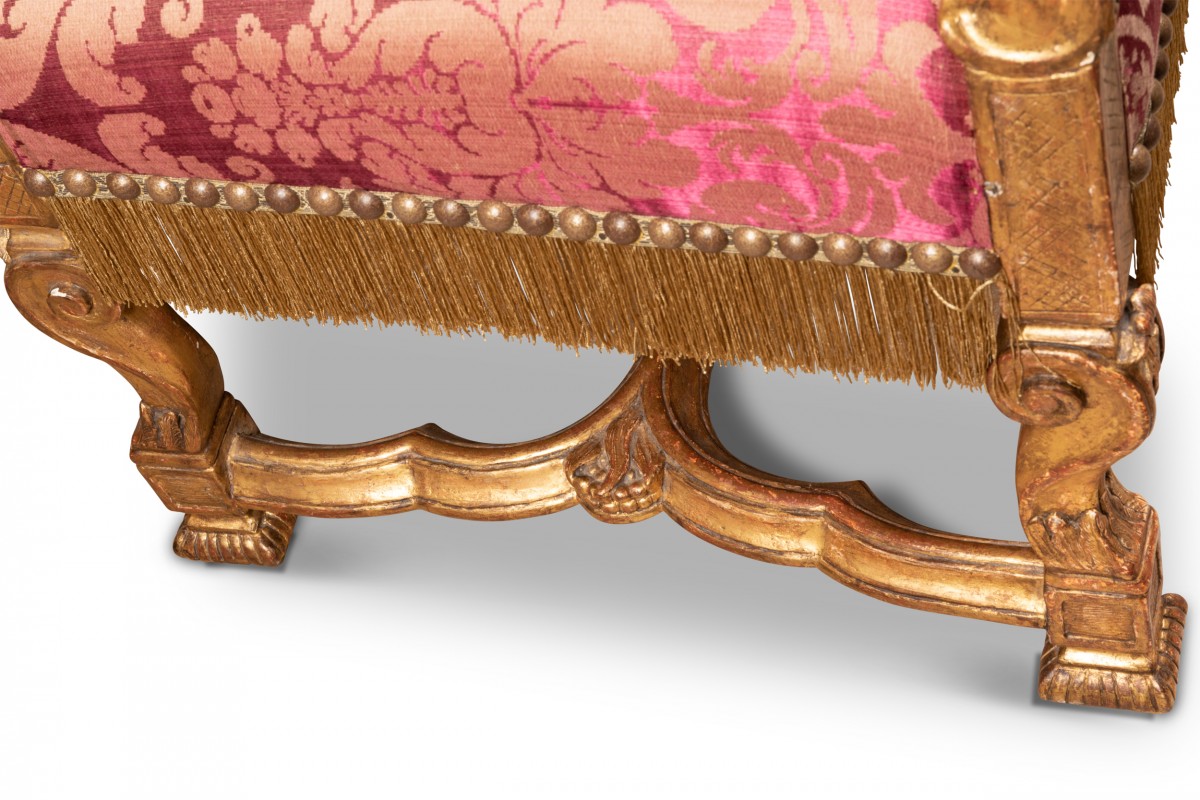 A Louis XIV style carved giltwood fauteuil