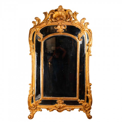 Miroir d'époque Régence en bois doré sculpté