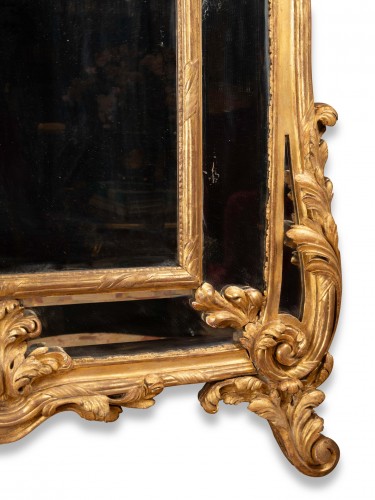 Miroirs, Trumeaux  - Miroir d'époque Régence en bois doré sculpté