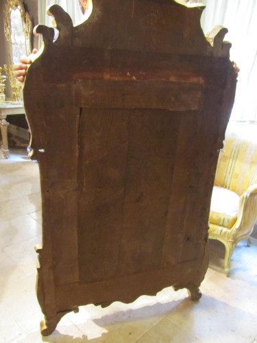 Antiquités - Miroir d'époque Régence en bois doré sculpté