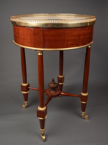 A Louis XVI  ormolu-mounted mahogany Gueridon - 