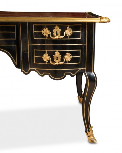 French Regence - A Regency ormolu-mounted blackened wood Bureau Plat