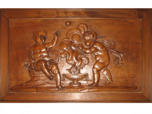 A mid 18th century carved wood panel