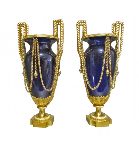 A pair of Louis XVI gilt- bronze and Creusot blue tinted glass