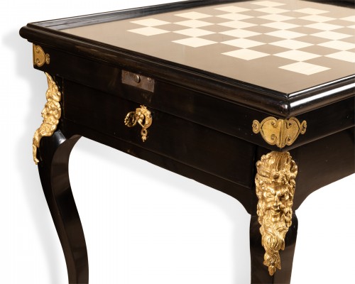 Antiquités - A Regence blackened pearwood games table