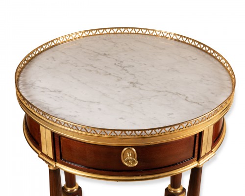 Furniture  - A late Louis XVI ormolu-mounted Mahogany Gueridon 