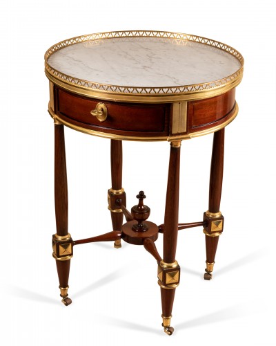 A late Louis XVI ormolu-mounted Mahogany Gueridon  - 