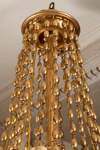 Lustre en bois sculpté et doré tout début XIXe siècle - Luminaires Style Empire