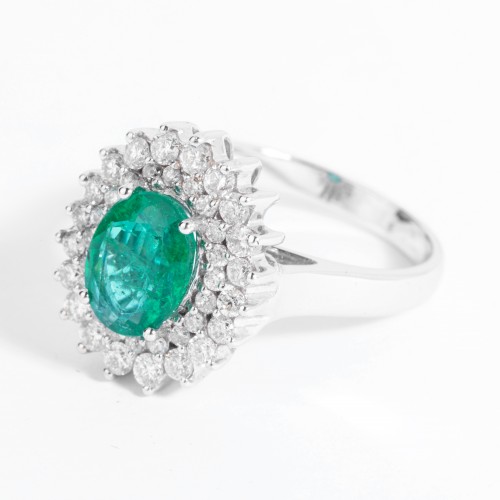 white gold ring set with an emerald and small diamonds - 