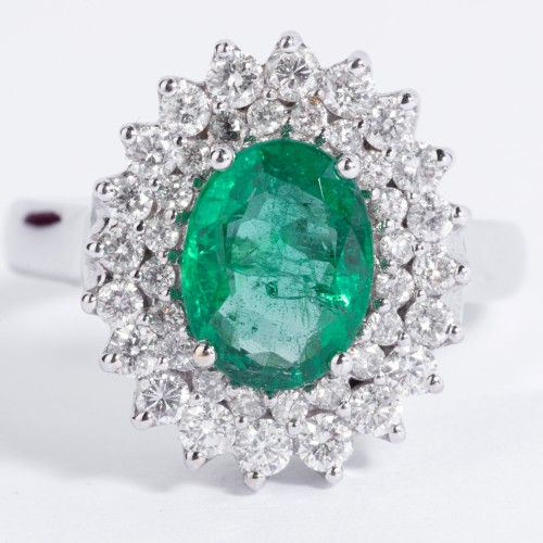 white gold ring set with an emerald and small diamonds - 
