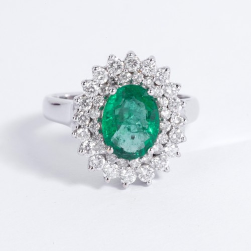 - white gold ring set with an emerald and small diamonds