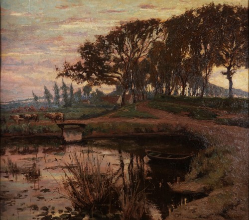 Paul Leduc (1876 - 1943) - Paysage flamand avec un bateau dans un étang et des vaches traversant un pont