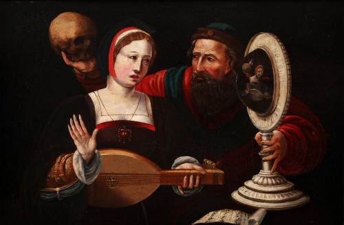 Une jeune femme et un homme plus âgé tenant un miroir convexe - Ecole flamande