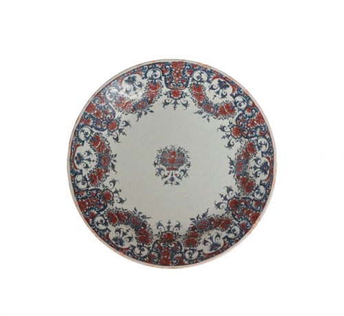 Rouen earthenware plate decorated with blue and red mantling