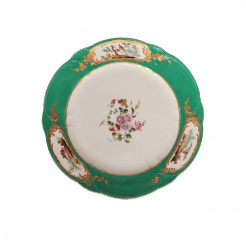 Plate in soft porcelain of Sevres with green background, marked F for 1759