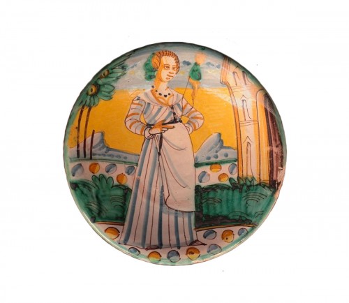 Plat en majolique de Montelupo à décor d'une fileuse, XVIIe siècle