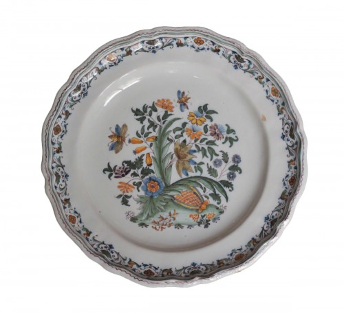 Moustiers plate with pomegranate decoration, 18th century.