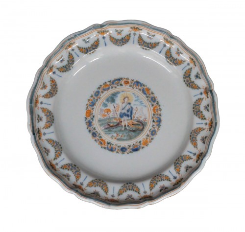 Moustiers faience plate with Apollon and the snake Python, 18th century.