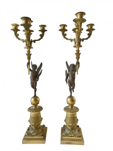 Paire de candélabres restauration en bronze patiné et bronze doré