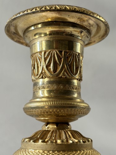 Antiquités - Paire de bougeoirs Empire en bronze doré et patiné
