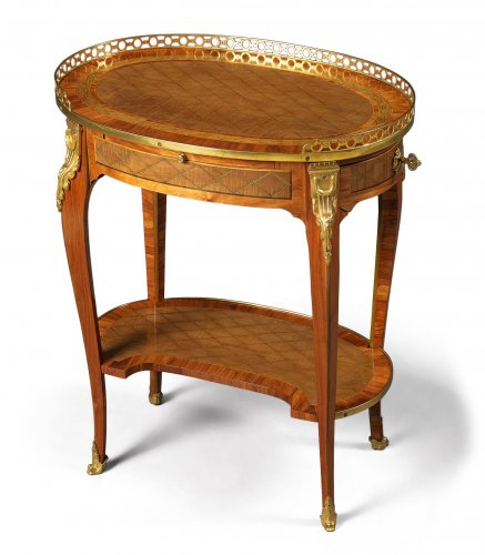 A French Transitional Small Oval Writing Table