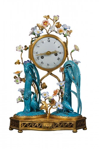 A Louis XV gilded bronze and porcelain clock signed  L. Montjoue à Paris