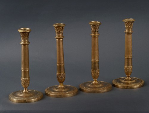 Four Charles X candlesticks in gilt bronze - 