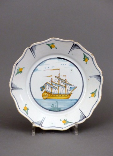 A Louis XV faience plate from Nevers - Louis XVI