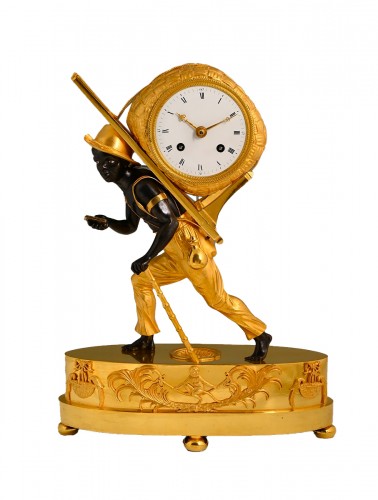 A French empire &#039;au bon sauvage&#039; mantel clock Portefaix