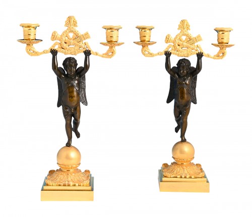 A pair of ormolu and patinated bronze candelabras circa 1820