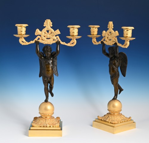 A pair of ormolu and patinated bronze candelabras circa 1820 - 
