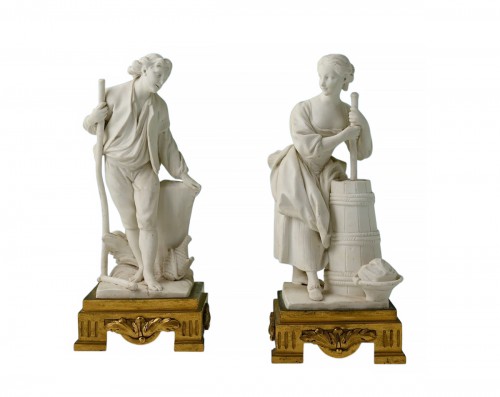 A set of two decorative biscuit-porcelain figures