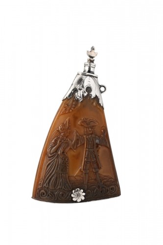 A 17th-century Dutch powder horn decorated with an erotic scene.