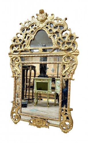 Gilded wooden mantelpiece mirror from the Regence period, 18th century